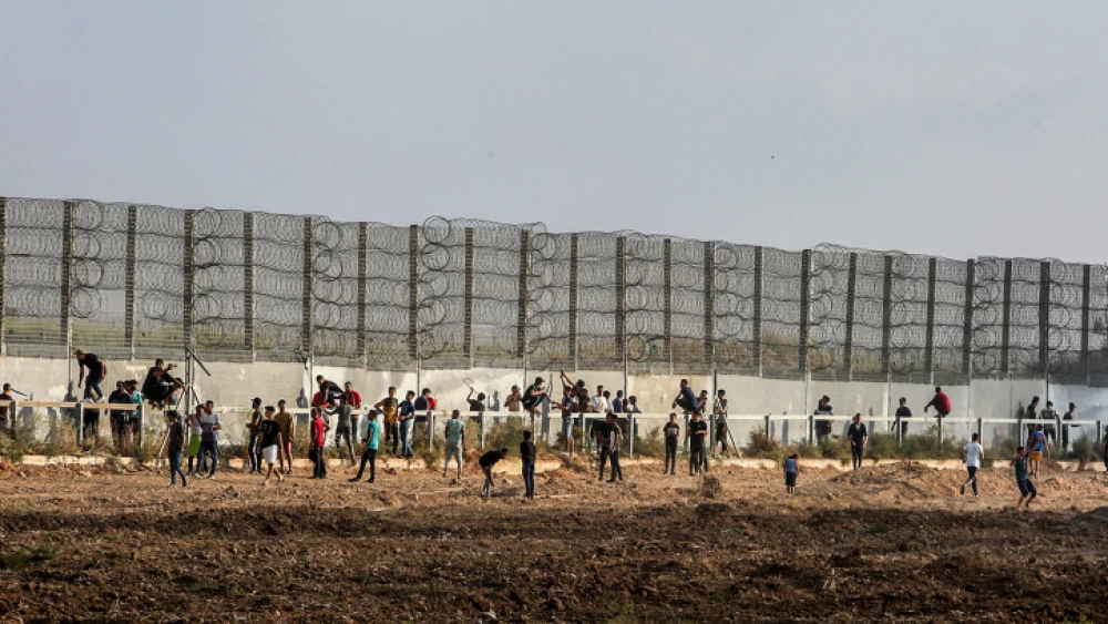 Palestinian protesters clash with Israeli forces during a protest at the Israel-Gaza border on Aug. 21, 2021. Photo by Abed Rahim Khatib/Flash90.
