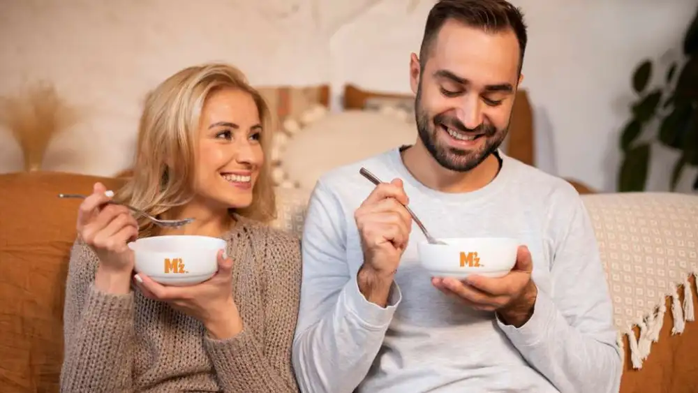 Happy couple eating Manischewitz soup