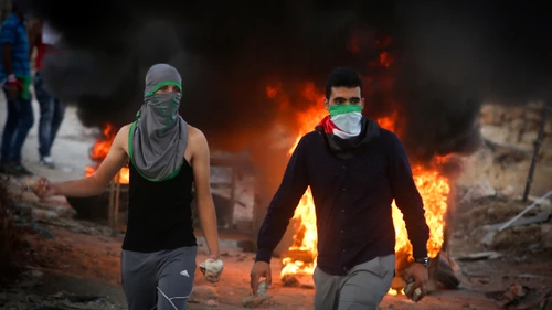 Click photo to download. Caption: A violent Palestinian riot on Sept. 30, 2015, near the Hezma checkpoint in the West Bank. Credit: Flash90.