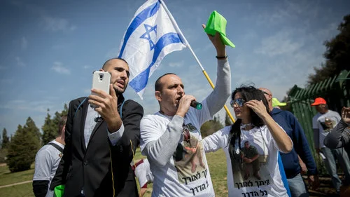 Supporters of Elor Azaria, the Israeli soldier convicted of manslaughter for shooting neutralized Palestinian terrorist Abdel Fattah al-Sharif last year in Hebron, demonstrate outside the Knesset March 15, 2017. Credit: Miriam Alster/Flash90.