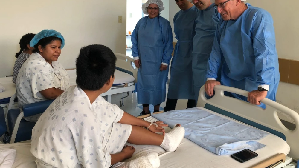 Dr. Elhanan Bar-On treats a patient in Guatemala. Credit: Courtesy.