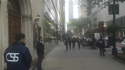 Community Security Service volunteers stand guard outside an urban synagogue. Credit: Community Security Service.