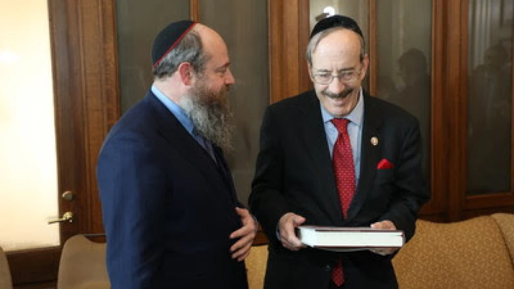 Rabbi Menachem Even-Israel, the son of Rabbi Adin Even-Israel Steinsaltz, presents the first volume of the Steinsaltz Talmud to Rep. Eliot Engel (D-N.Y.). Credit: The Aleph Society.
