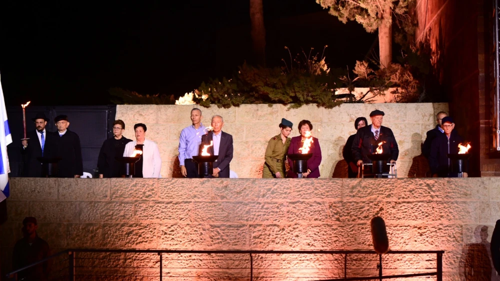 Six Holocaust survivors and family members light the memorial torches at Yad Vashem, April 13, 2026. Photo by Rafi Ben Hakoon/Yad Vashem.
