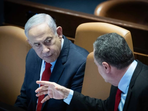 Prime Minister Benjamin Netanyahu speaks with then-Foreign Minister Israel Katz during a vote on the state budget at the Knesset in Jerusalem, March 13, 2024. Photo by Yonatan Sindel/Flash90.