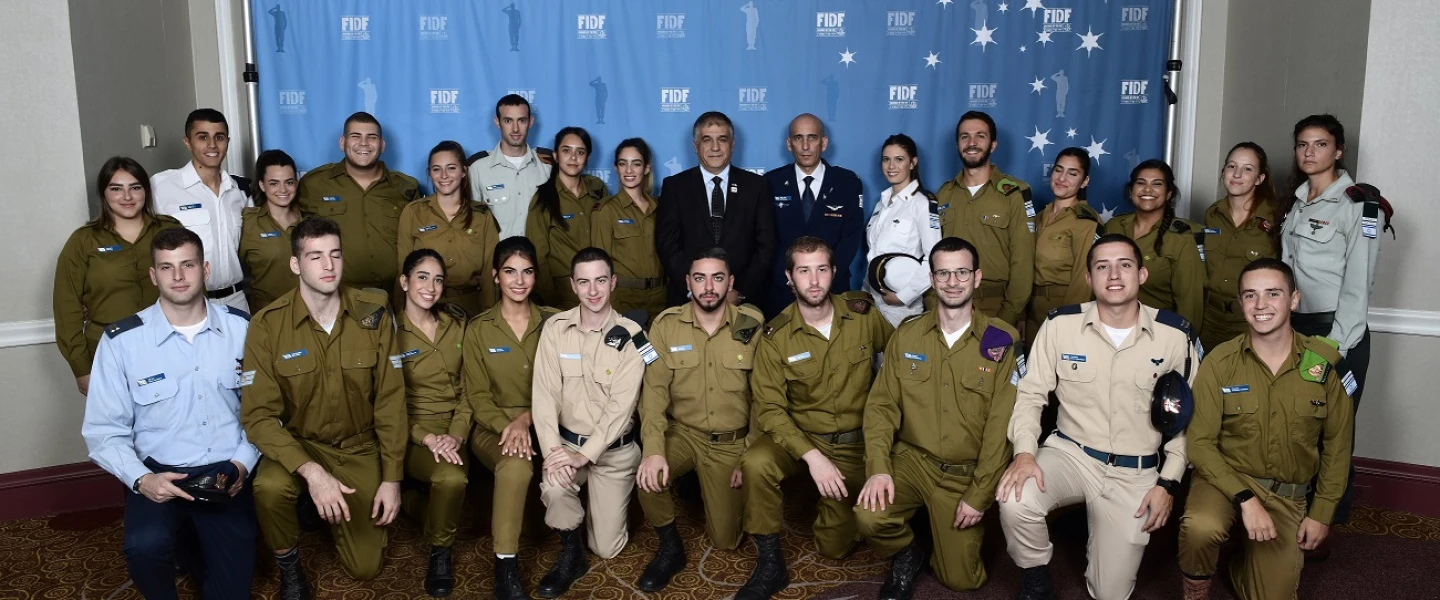 FIDF national director and CEO Maj. Gen. (Res.) Meir Klifi-Amir; Brig. Gen. Tal Kelman, head of the Strategic Division of the IDF Planning Directorate and former Chief of Staff in the Israeli Air Force (IAF); with Israeli soldiers at the 2018 FIDF National New York Gala Dinner on Oct. 17, 2018. Credit: Shahar Azran.