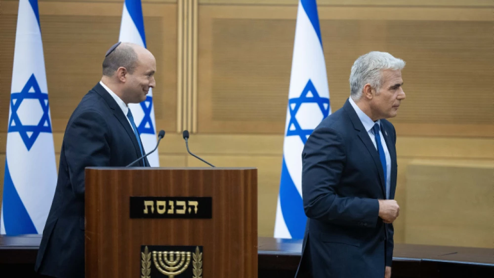 Israeli Prime Minister Naftali Bennett and Foreign Minister Yair Lapid hold a joint press conference at the Israeli parliament in Jerusalem on June 20, 2022. Photo by Yonatan Sindel/Flash90.