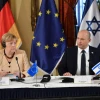 German Chancellor Angela Merkel with Israeli Prime Minister Naftali Bennett at a special Cabinet session at the King David Hotel in Jerusalem, Oct. 10, 2021. Photo by Yoav Dudkevitch/POOL.