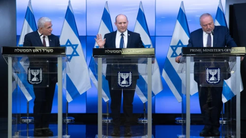 Israeli Prime Minister Naftali Bennett (center), Foreign Affairs Minister Yair Lapid (left) and Finance Minister Avigdor Liberman give a press conference in Jerusalem on Nov. 6, 2021. Photo by Ohad Zwigenberg/POOL.