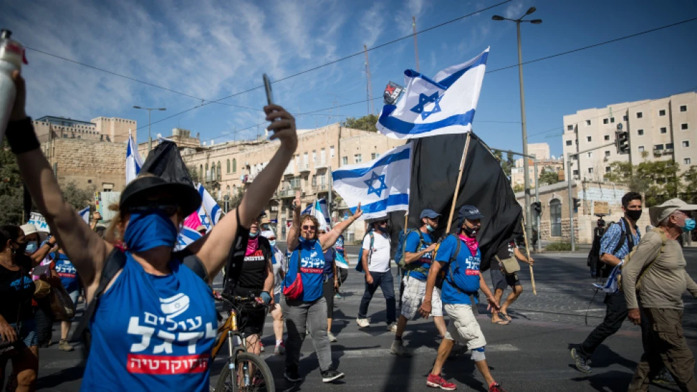 Israelis take part in a protest march against Israeli Prime Minister Benjamin Netanyahu in Jerusalem on Oct. 8, 2020. Photo by Yonatan Sindel/Flash90.
