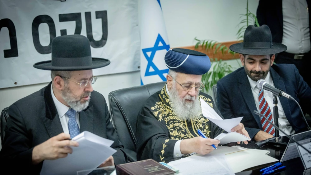 Israel's Chief Rabbis David Lau (left) and Yitzhak Yosef (center) sell the state's chametz in Jerusalem ahead of Passover, April 21, 2024. They left their posts on June 30. Photo by Chaim Goldberg/Flash90.