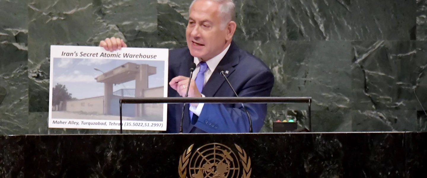 Israeli Prime Minister Benjamin Netanyahu addresses the U.N. General Assembly in New York, visual in hand, revealing a hidden Iranian nuclear facility and secret missiles in Lebanon’s capital, on Sept. 27, 2018. Photo by Avi Ohayon/GPO.