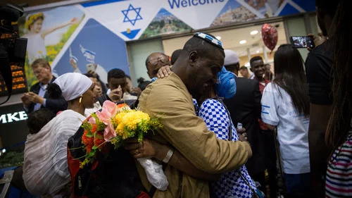 Ethiopian Jews are greeted by family members as they arrive at Israel’s Ben-Gurion Airport, as part of an aliyah flight arranged by the Jewish Agency for Israel and sponsored by the International Christian Embassy Jerusalem in June 2017. Credit: Miriam Alster/Flash90.