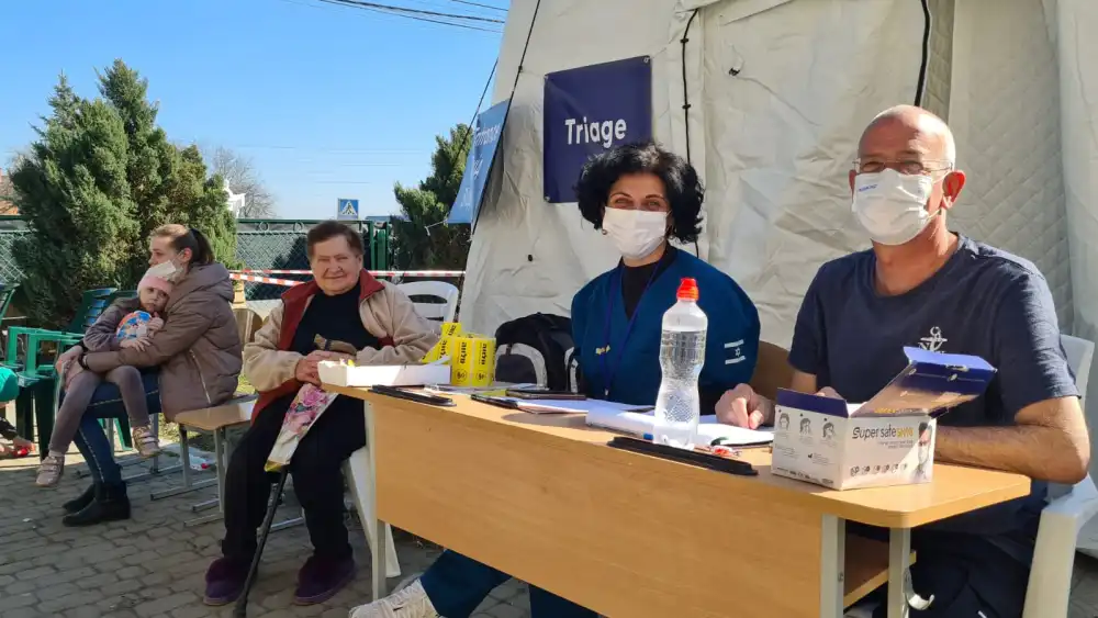 Dr. David Dagan, right, of the Israeli Health Ministry, outside the triage area of the Shining Star field hospital in Ukraine. Photo by Naama Frank Azriel.