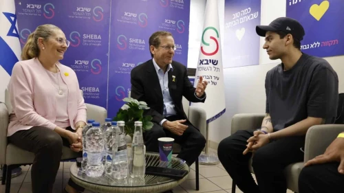 Israeli President Isaac Herzog, center, and his wife, Michal Herzog, talk with freed hostage Yosef-Haim Ohana at Sheba Medical Center in Ramat Gan on Oct. 17, 2025. Source: @Isaac_Herzog/X.