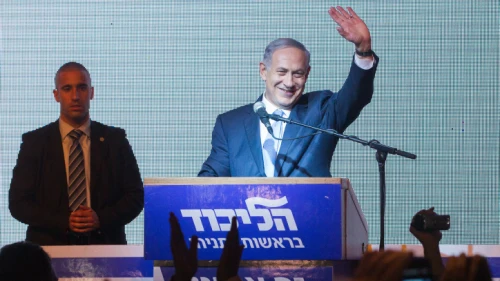 Israeli Prime Minister Benjamin Netanyahu waves to supporters at Likud headquarters in Tel Aviv on March 18, 2015, after general elections with Netanyahu claiming victory. Photo by Miriam Alster/Flash90.
