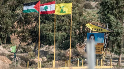 From left, PLO, Lebanese and Hezbollah flags are seen on the Lebanese side of the border near Metula in northern Israel, Dec. 05, 2018. Photo by Kobi Richter/TPS.