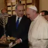 Israeli Prime Minister Benjamin Netanyahu presents Pope Francis with a menorah during their meeting at the Vatican on Dec. 2, 2013. Pope Francis visited Israel, Jordan and the West Bank from May 24-26. Credit: Amos Ben Gershom/GPO/Flash90.