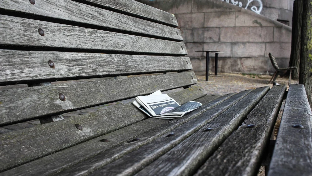 Newspaper Left on Bench