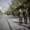 Israelis stand in silence in Jerusalem as a two-minute siren is sounded across the country to mark Holocaust Remembrance Day, April 21, 2020. Photo by Yonatan Sindel/Flash90.