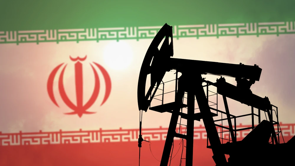An oil pump on the background of the flag of Iran. Photo by Anton Watman/Shutterstock.