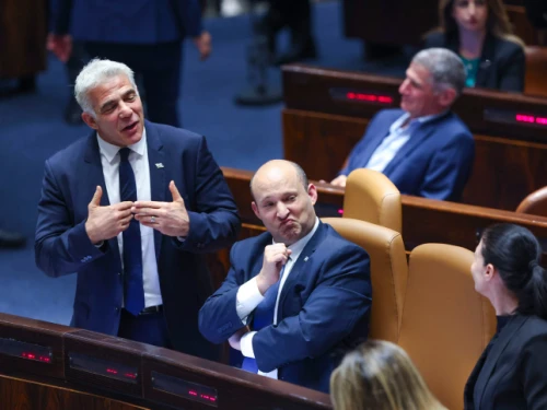 Then-Israeli Prime Minister Naftali Bennett (center), Foreign Minister Yair Lapid (left) and Defense Minister Benny Gantz attend a vote on the “settler law” bill at the Knesset, June 6, 2022. Photo by Yonatan Sindel/Flash90.
