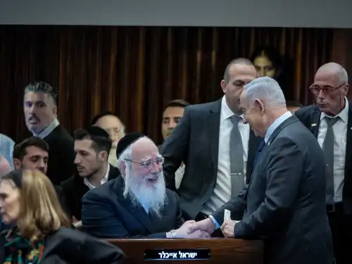 Israeli Prime Minister Benjamin Netanyahu speaks with MK Israel Eichler at the Knesset in Jerusalem, Feb. 19, 2024. Photo by Yonatan Sindel/Flash90.