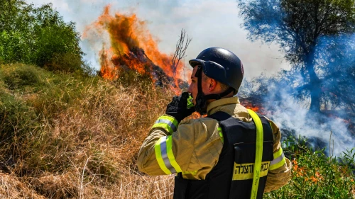 A Firefighter at a wildfire following a missile attack from Lebanon, near Kibbutz Snir in the Galilee panhandle, Sept. 16, 2024. Photo by Ayal Margolin/Flash90.