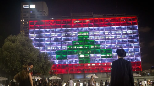 The Tel Aviv municipality on Rabin Square is lit up with the Lebanese flag on Aug. 5, in solidarity with the civilians killed in multiple explosions in Beirut the day before, on Aug. 5, 2020. Photo by Miriam Alster/Flash90.