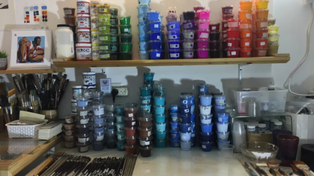 Acrylic paints neatly stacked in Nirit Takele’s art studio. Photo by Diana Bletter.