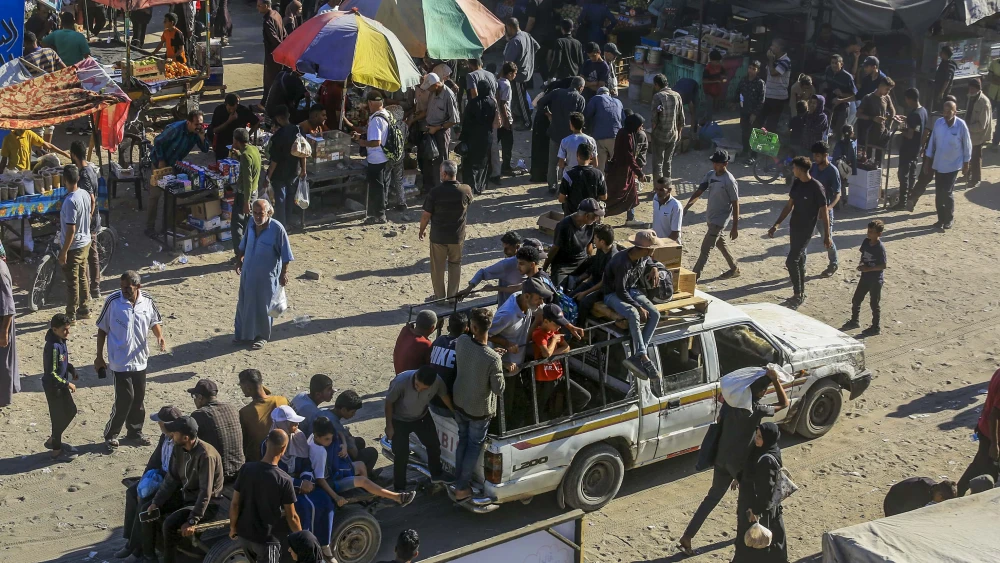 Palestinians shop at a market in Khan Yunis, in the southern Gaza Strip, a few days after a ceasefire agreement between Israel and Hamas, Oct. 14, 2025. Photo by Abed Rahim Khatib/Flash90.