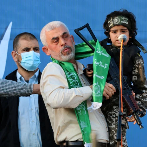 Hamas chief in Gaza Yahya Sinwar holds a boy dressed as a Hamas terrorist during a rally in Gaza City, May 24, 2021. Photo by Atia Mohammed/Flash90.