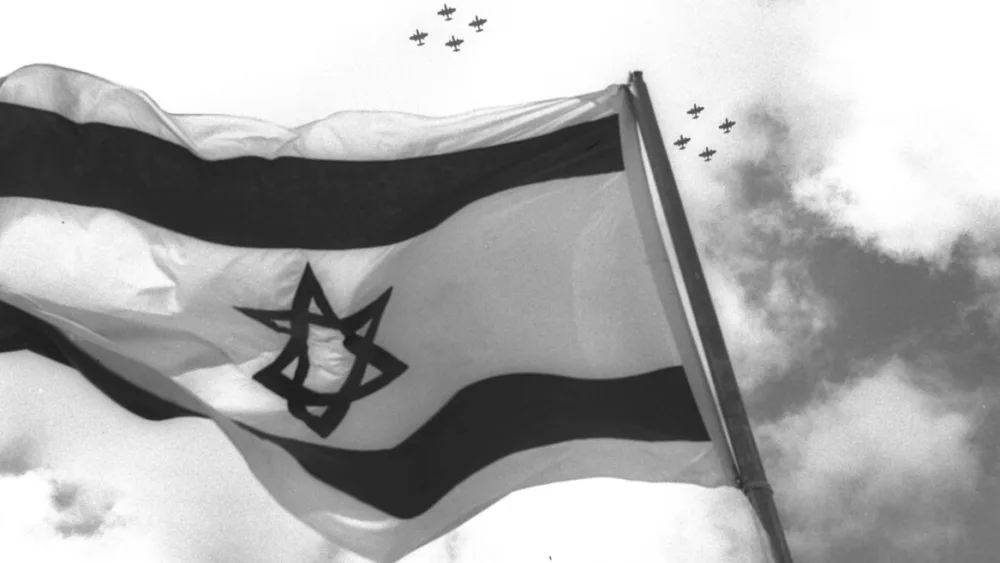 Israeli fighter jets fly over the nation's flag on Independence Day celebrations in 1957. Photo by Moshe Pridan/Government Press Office.