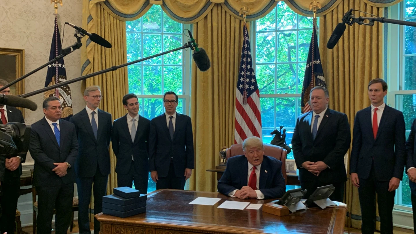 U.S. President Donald Trump and senior members of his administration in the Oval Office of the White House as Sudan agrees to normalize relations with Israel. Credit: Michael Crowley/The New York Times for White House/POOL.