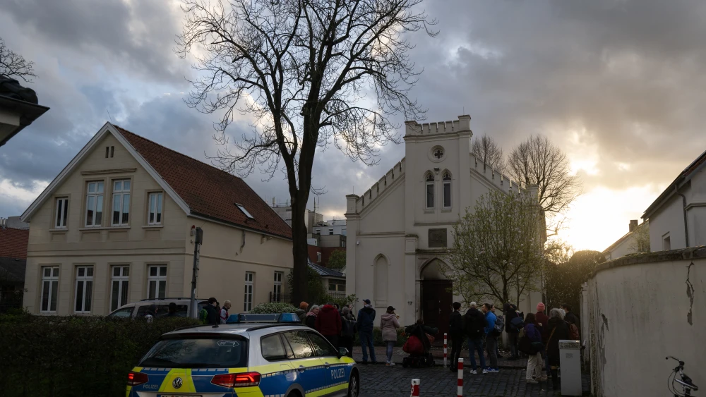 People gather for an impromptu vigil outside the Oldenburg Synagogue following an attempted arson attack earlier in the day on Apr. 5, 2024 in Oldenburg, Germany. Photo by David Hecker/Getty Images.