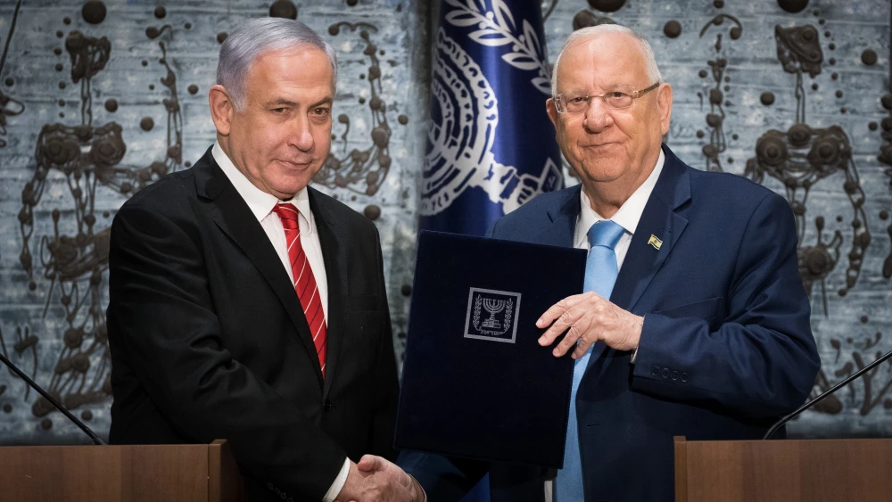 Israeli President Reuven Rivlin presents Israeli Prime Minister Benjamin Netanyahu with the mandate to form a new government, after the results of the country's votes were announced following the Sept. 17 elections, at the President's Residence in Jerusalem on Sept. 25, 2019. Photo by Yonatan Sindel/Flash90.