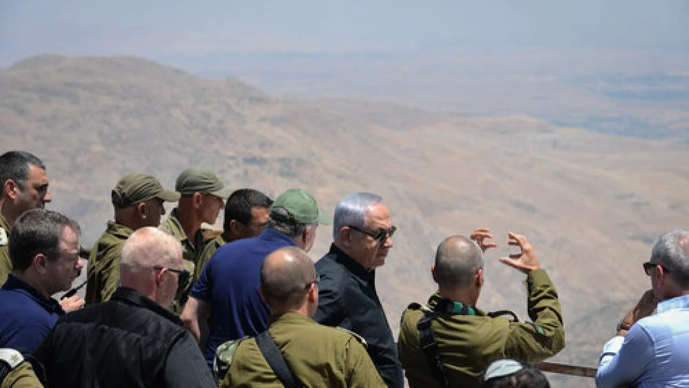 Israeli Prime Minister Benjamin Netanyahu and Security Cabinet members look into Syria from the Golan Heights, Feb. 6, 2018. Photo by Kobi Gideon/GPO.