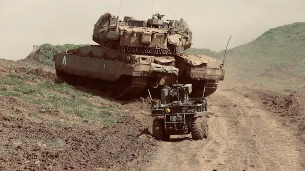 A robotic vehicle and a tank maneuver as part of the IDF's International Operational Innovation Conference at the Tze’elim Base in the Negev last week. Credit: IDF Spokesperson's Unit.