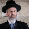 Israel's Ashkenazi Chief Rabbi David Lau attends a ceremony on the first night of Hanukkah, at the Western Wall in Jerusalem, Nov. 28, 2021. Photo by Flash90.