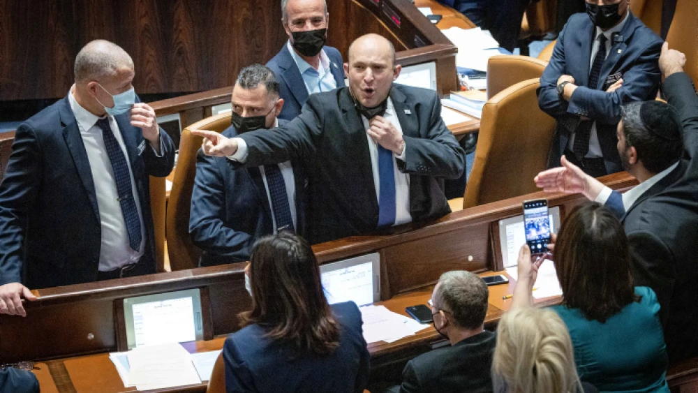 Israeli Prime Minister Naftali Bennett reacts during a stormy discussion of the Electricity Law, during a Knesset plenum session, Jan. 5, 2022. Photo by Yonatan Sindel/Flash90.