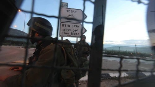 Israeli soldiers block a road near Huwara, south of the Samaria city of Nablus (Shechem), March 12, 2011. Photo by Nati Shohat/Flash90.