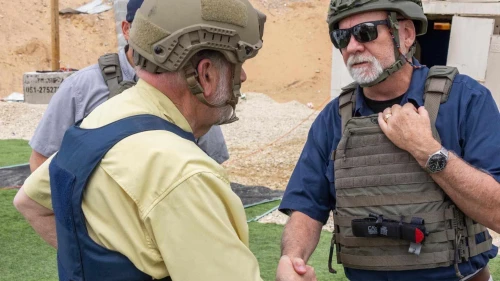 U.S. Ambassador to Israel Mike Huckabee (left) joins Gaza Humanitarian Foundation staff during food distribution in Khan Yunis, Aug. 1, 2025. Credit: Gaza Humanitarian Foundation.