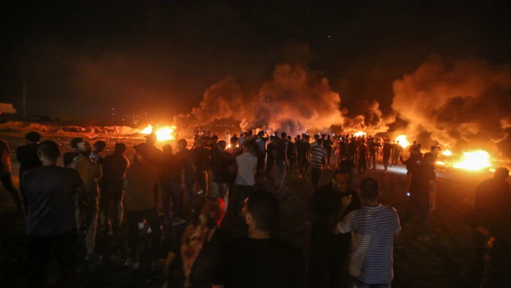 Palestinians riot near the border with Israel, near Gaza City, on Aug. 28, 2021. Photo by Atia Mohammed/Flash90.