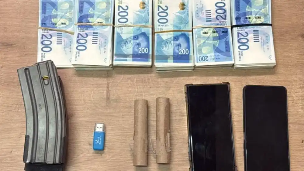 Items seized during a search of the suspect’s home are shown in this photo. Credit: Israel Police Spokesperson’s Unit.