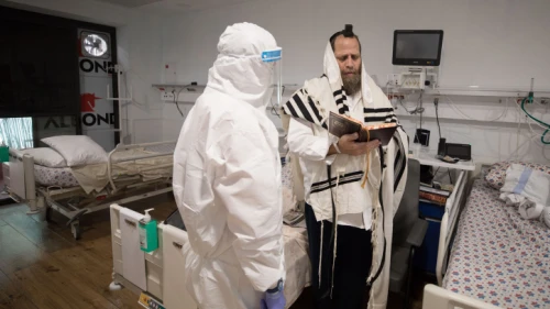 A coronavirus patient prays in the coronavirus unit at Maayanei Hayeshua Medical Center in Bnei Brak, Israel, on April 27, 2020. Photo by Nati Shohat/Flash90.