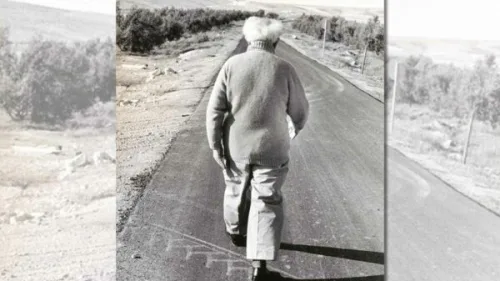 Israel's first prime minister, David Ben-Gurion, walks between his cabin at Kibbutz Sde Boker and the Midreshet Ben-Gurion school. Credit: Micha Baram/Archive.