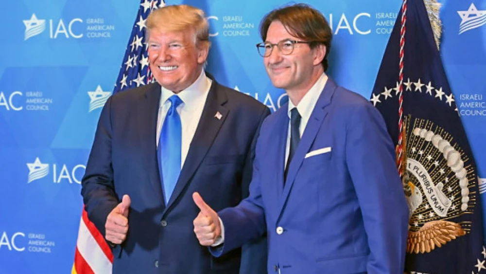 U.S. President Donald Trump with "Israel Hayom" editor-in-chief Boaz Bismuth at the IAC summit in Hollywood, Fla. Credit: Israel Hayom.