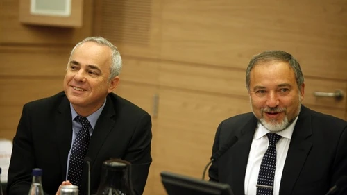 Yuval Steinitz (left), Israeli Minister of International Relations and Strategic Affairs, and Avigdor Lieberman at a Foreign Affairs and Defence committee meeting in the Israeli Parliament in Jerusalem on May 20, 2013. Steinitz on Monday said There is a “real possibility” that Syrian President Bashar al-Assad “could survive Syria’s civil war and even prevail in it.” Photo by Flash90.
