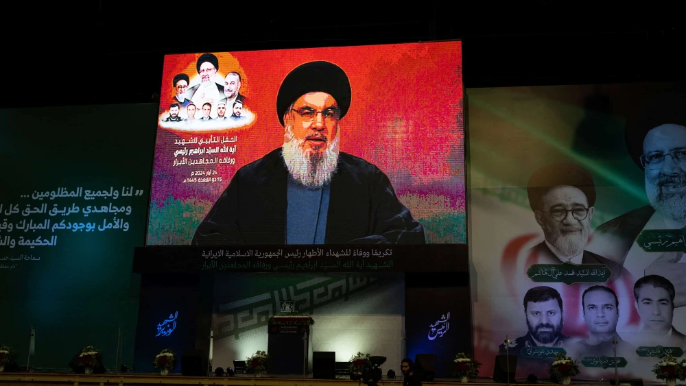 Lebanese watch a televised speech by Hezbollah Secretary General Hassan Nasrallah in a hanger in the Beirut suburb of Dahiyeh following the death of Iranian President Ebrahim Raisi in a helicopter crash, May 24, 2024. Photo by Oliver Marsden/Middle East Images/AFP via Getty Images.