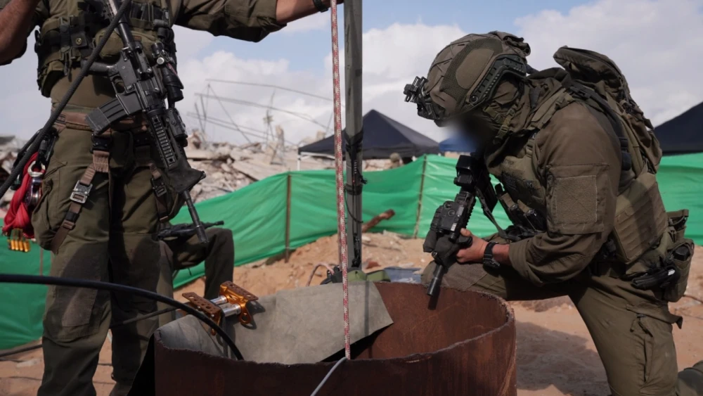 Israeli soldiers stand at the entrance to a Hamas tunnel in Rafah, in the southern Gaza Strip, that the military says stretched more than 16 kilometers and once held Lt. Hadar Goldin, whose remains were returned in 2025 as part of a hostage deal. Credit: IDF.
